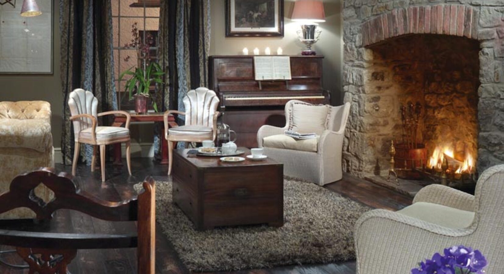 The welcoming sitting room with log fire