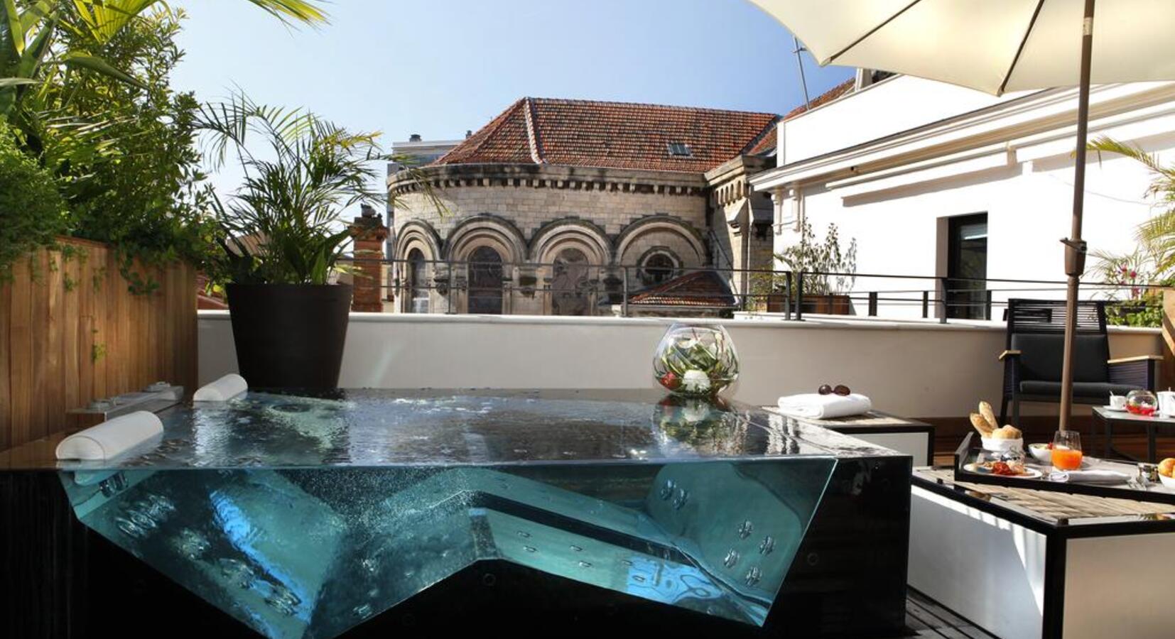 Presidential Suite with glass and stainless steel outdoor jacuzzi