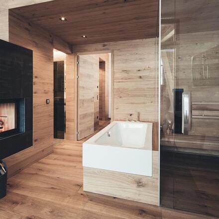 En suite bath and shower with fireplace