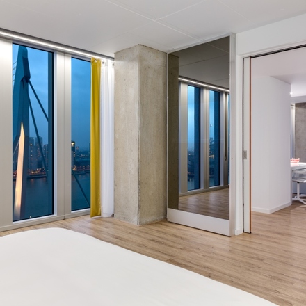 nhow Suite overlooking the river Maas, the Erasmusbridge and the skyline of the city