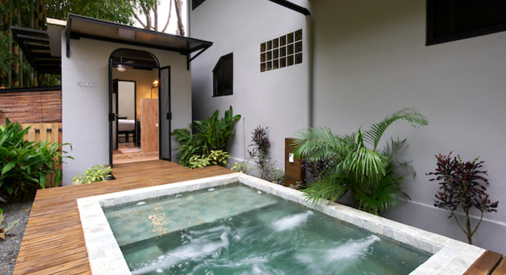 Private in-ground stone hot tub in our 2-Bedroom Villa Tropical