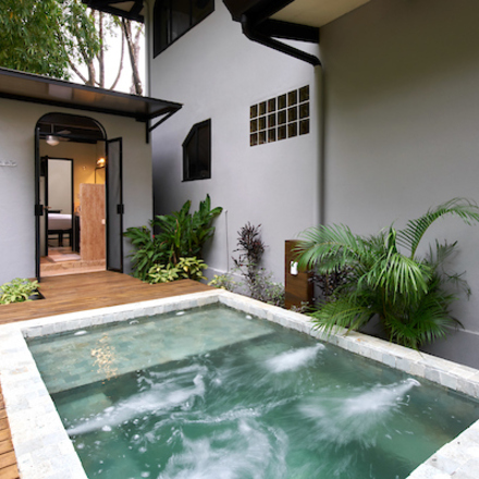 Private in-ground stone hot tub in our 2-Bedroom Villa Tropical