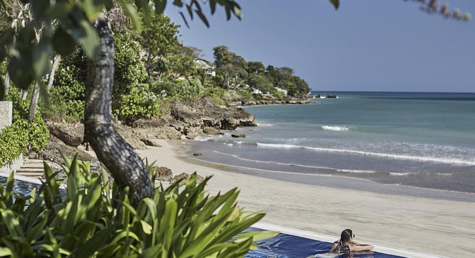 Infinity pool and beach beyond