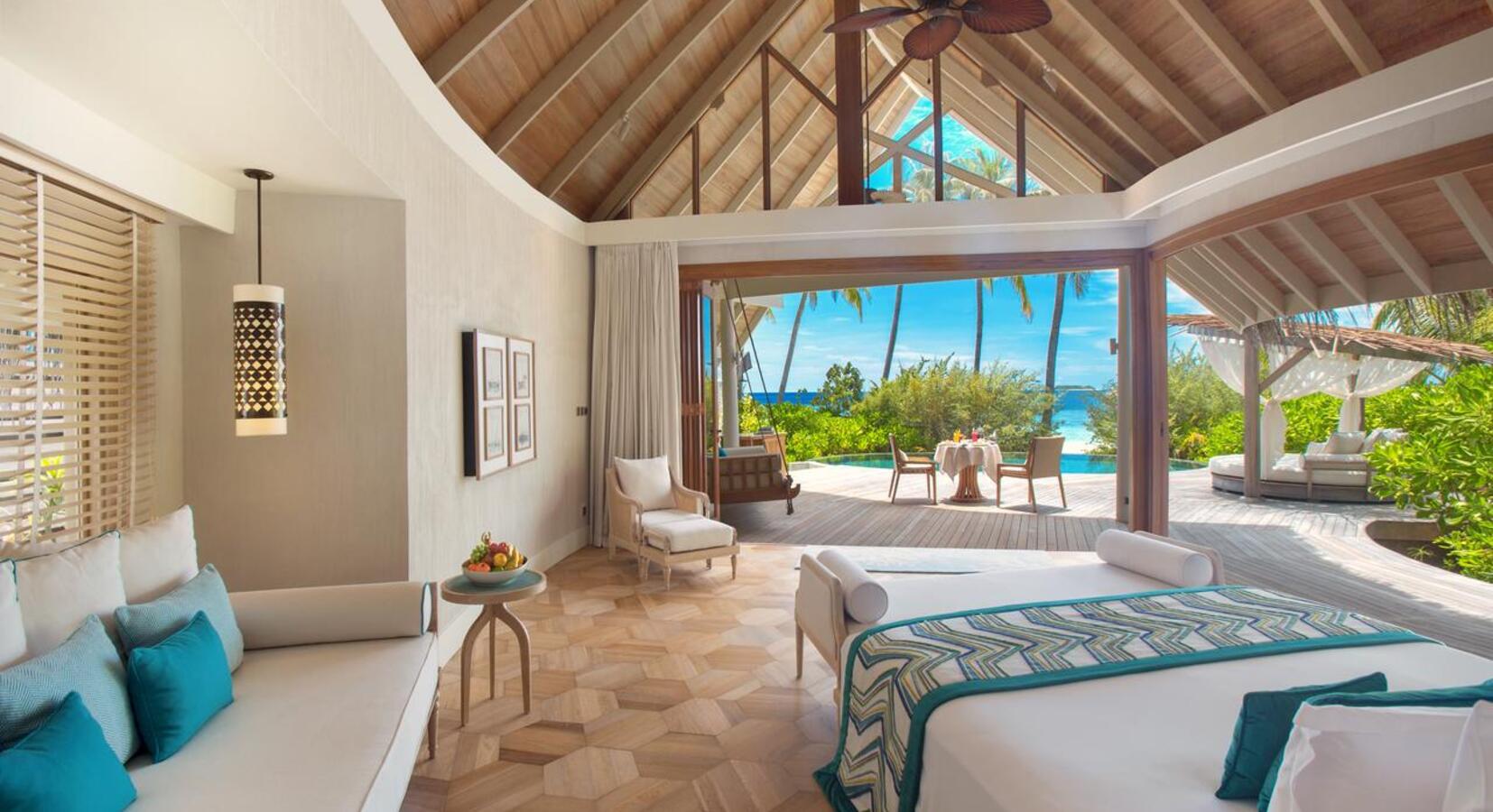 Beach villa open plan bedroom with 180 degree views.