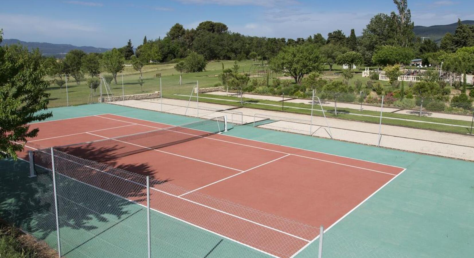 Outdoor Tennis Court located in hotel's gadens 