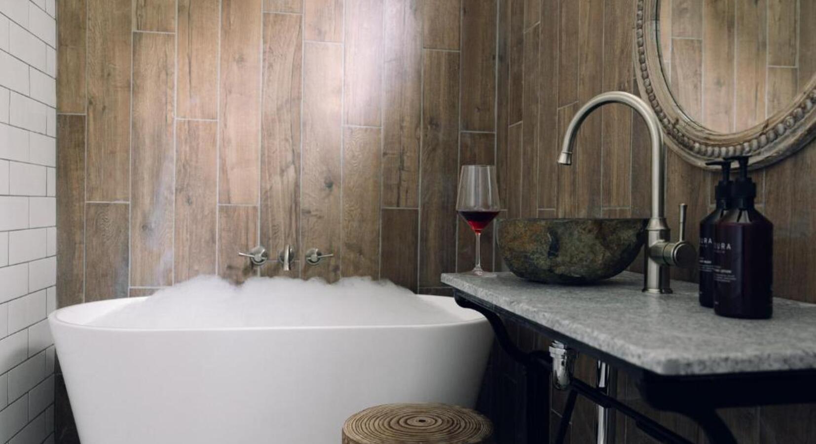 Wood-Panelled Bathroom with Tub