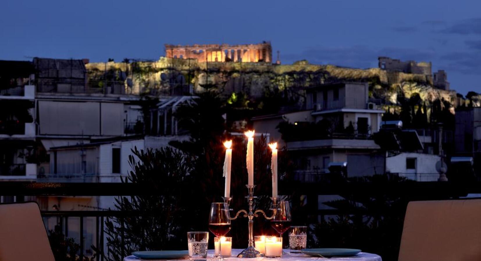 Outdoor dining with view of Acropolis