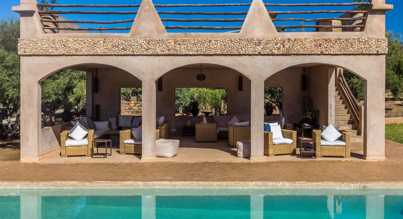 Heated Pool with shaded seated and sun terrace above