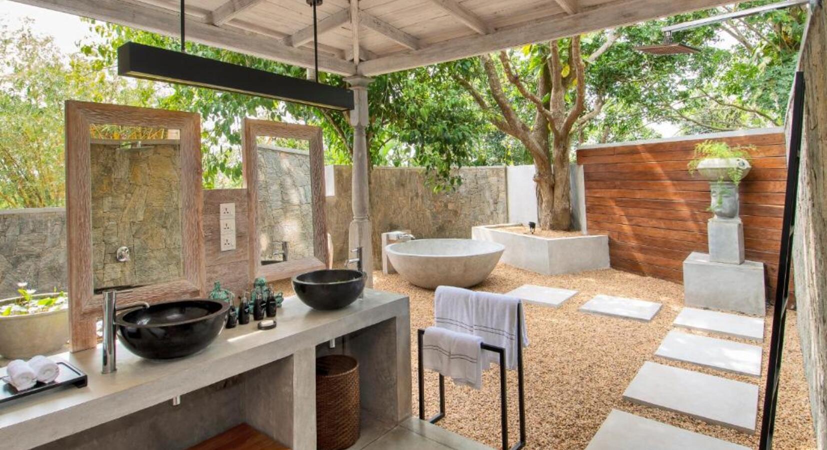 Outdoor Bathroom with Tub and Twin Sinks